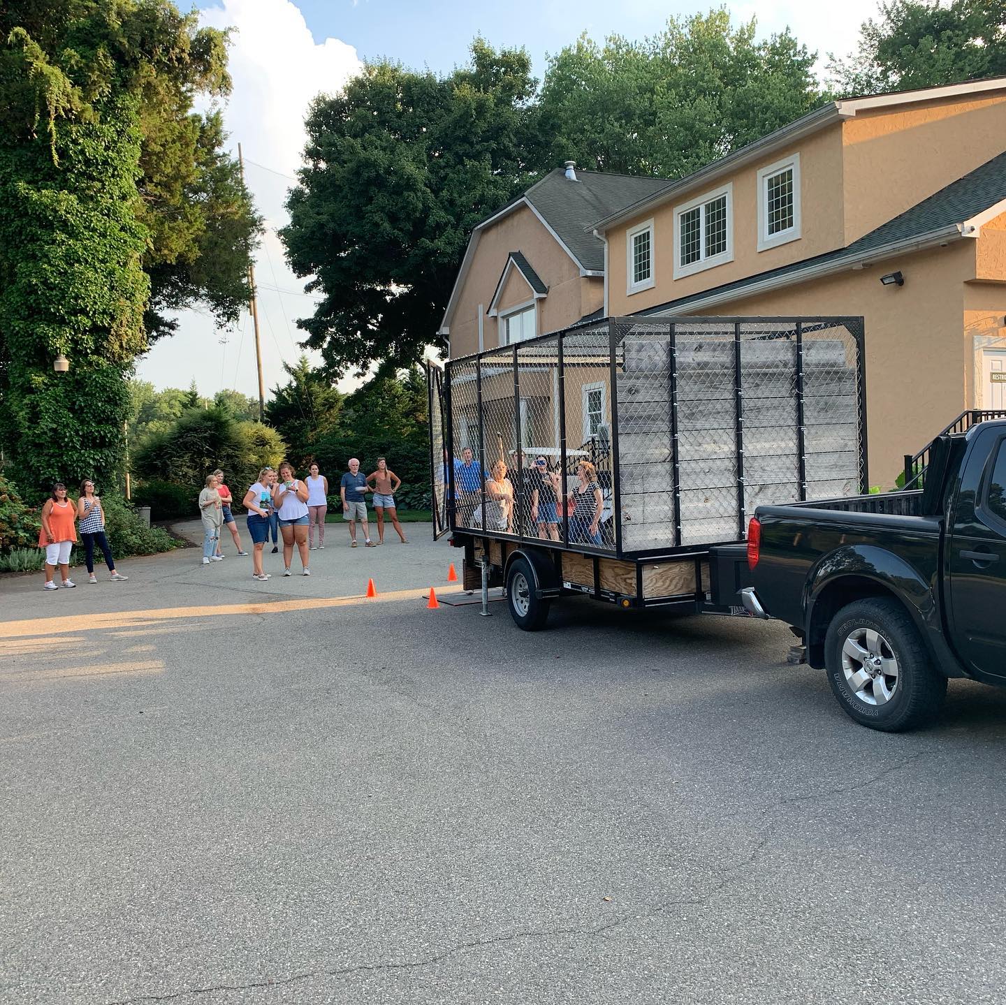 The Mobile Axe RVA truck and trailer arriving at a private home at golden hour