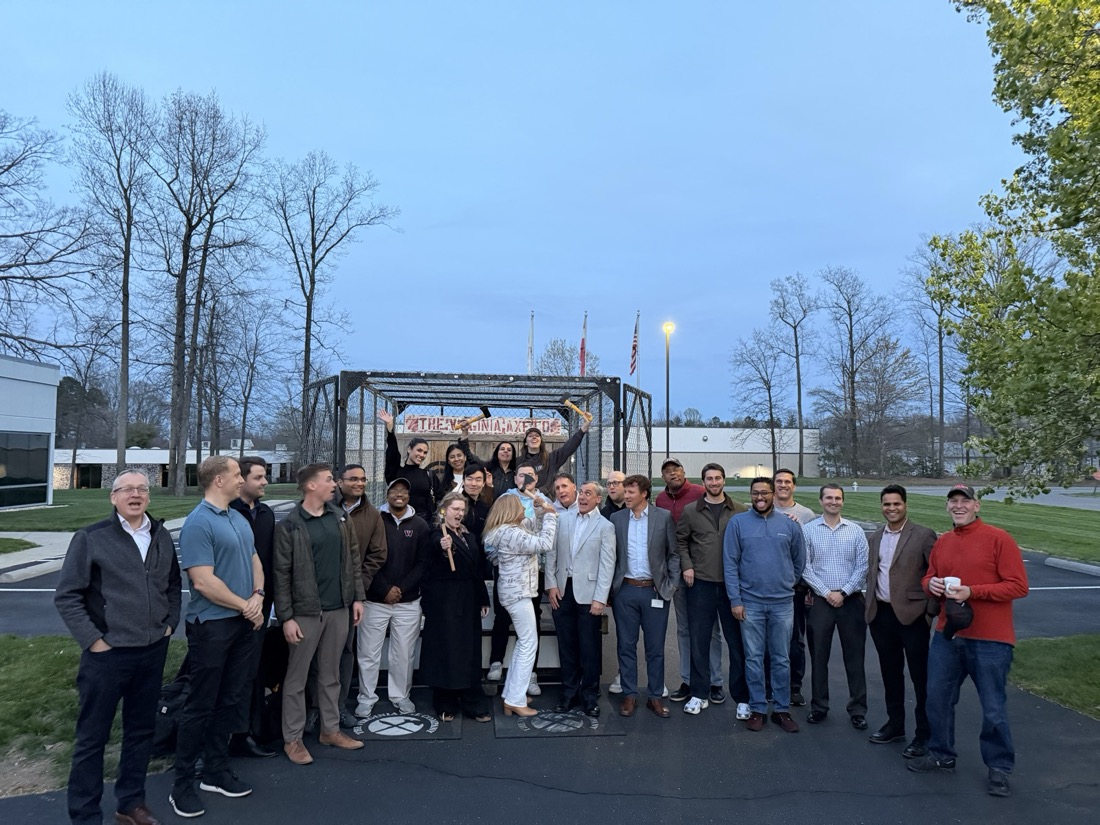 A large corporate group at the cage at blue hour